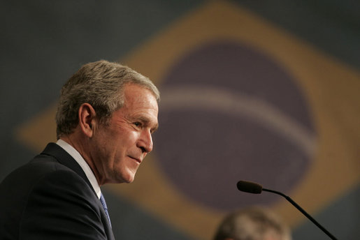 President George W. Bush smiles as he listens to Brazil President Luiz Inacio Lula da Silva reply to a question Friday, March 9, 2007, during a joint press availability in Sao Paulo. Said President Lula, "The memorandum of understanding on biofuels, which our ministers signed today, is a decisive step. Bringing together their efforts, the U.S. and Brazil can further push the democratization of energy and bring biofuels to all." White House photo by Paul Morse