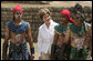 Mrs. Laura Bush poses with performers Monday, March 12, 2007, after a demonstration of a Mayan Ritual competition in Iximche, Guatemala. President and Mrs. Bush visited three Guatemalan villages during the morning hours before departing for Mexico, the last stop of their five-country, Latin American visit. White House photo by Paul Morse