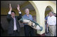 President George W. Bush holds a gift from Mayor Raymundo Juarez during a visit Monday, March 12, 2007, to Santa Cruz Balanya, Guatemala. Pictured at right is Guatemalan President Oscar Berger. White House photo by Eric Draper