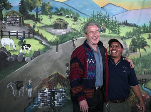 President George W. Bush meets with an employee Monday, March 12, 2007, at the Labradores Mayas Packing Station in Chirijuyu, Guatemala. The President and Mrs. Laura Bush are on the fourth leg of a five-country trip through Central and South America. They are scheduled to arrive in Mexico later in the day. White House photo by Paul Morse
