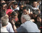 President George W. Bush reaches for a young Guatemalan child during his visit Monday, March 12, 2007, to Santa Cruz Balanya. The President and Mrs. Bush visited three Guatemala villages Monday morning before traveling to Mexico. White House photo by Paul Morse