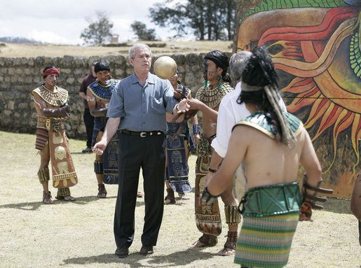 President George W. Bush tests his skills as he joins athletes in a Mayan Ritual Competition during a tour Monday, March 12, 2007, to Iximche, Guatemala. White House photo by Eric Draper