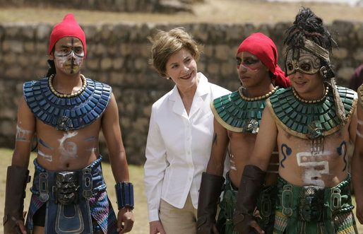 Mrs. Laura Bush poses with performers Monday, March 12, 2007, after a demonstration of a Mayan Ritual competition in Iximche, Guatemala. President and Mrs. Bush visited three Guatemalan villages during the morning hours before departing for Mexico, the last stop of their five-country, Latin American visit. White House photo by Paul Morse