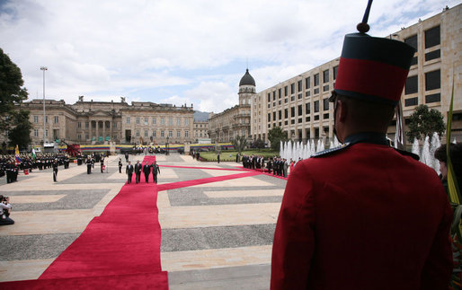 President George W. Bush stands at attention during an arrival ceremony with Colombian President Alvaro Uribe at Casa de Narino in Bogotá, Colombia, Sunday, March 11, 2007. White House photo by Paul Morse