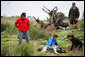 Mrs. Laura Bush works with wildlife biologist John Klavitter during a tour of Eastern Island on Midway Atoll, part of the Northwest Hawaiian Islands National Monument Thursday, March 1, 2007. Interior Secretary Dirk Kempthorne is pictured in a red jacket. White House photo by Shealah Craighead