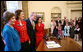 President George W. Bush and Mrs. Laura Bush embrace Lynda Bird Johnson Robb and Luci Baines Johnson, right, in the Oval Office, Friday, March 23, 2007, following the signing of H.R. 584 designating the U.S. Department of Education in Washington, D.C., as the Lyndon Baines Johnson Federal Building. White House photo by Eric Draper