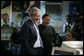 President George W. Bush and Meninos do Morumbi founder Flavio Pimenta share a bright moment with a student during a visit to the center Friday, March 9, 2007, by the President and Mrs. Laura Bush in Sao Paulo. White House photo by Eric Draper