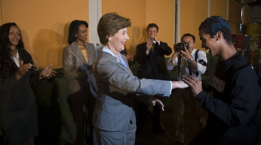 Mrs. Laura Bush is led by a student during a dance performance Friday, March 9, 2007, at Sao Paulo's Meninos do Morumbi. The stop at the center capped a daylong visit to the Brazilian city and marked the end of the first leg or a five-country, Latin American tour. White House photo by Paul Morse