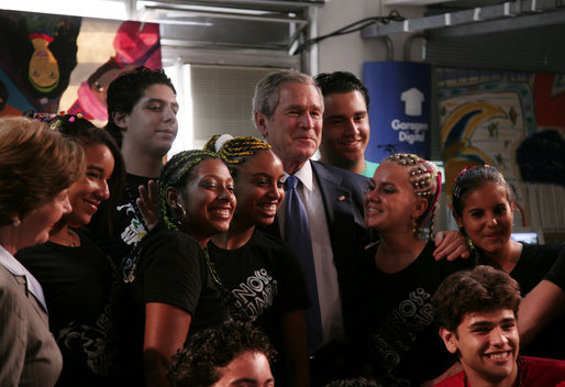 With Mrs. Laura Bush looking on, President George W. Bush poses for a photo Friday, March 9, 2007, with students at Meninos do Morumbi, a center for young people in Sao Paulo that teaches musical skills as an alternative to drugs and crime. White House photo by Paul Morse