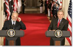 President George W. Bush and Dr. Ibrahim Jaafari, Prime Minister of Iraq, take questions from the media during a joint press conference Friday, June 24, 2005, in the East Room of the White House.  White House photo by Paul Morse