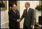 President George W. Bush welcomes Foreign Minister Kurshid Mahmood Kasuri of Pakistan to the Oval Office Thursday, June 9, 2005. White House photo by Paul Morse