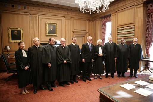 President George W. Bush stands with U.S. Supreme Court Chief Justice John Roberts, as they pose for photos with U.S. Supreme Court Associate Justices, from left to right, Justice Ruth Bader Ginsburg, Justice David H. Souter, Justice Anthonin Scalia, Justice John Paul Stevens, Justice Sandra Day O'Connor, Justice Anthony Kennedy, Justice Clarence Thomas and Justice Stephen G. Breyer, during the investiture ceremony for Chief Justice Roberts, Monday, Oct. 3, 2005 at the Supreme Court in Washington. White House photo by Eric Draper