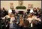 President George W. Bush and Poland's President Aleksander Kwasniewski meet with reporters in the Oval Office at the White House, Wednesday, Oct. 12, 2005 in Washington. White House photo by Eric Draper