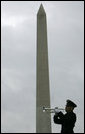 A soldier plays taps upon the conclusion of a wreath-laying ceremony at the National World War II Memorial Friday, Oct. 7, 2005, in Washington D.C., where Vice President Dick Cheney remarked, ".You served honorably in a desperate era for our country. And in pivotal hours of the Second World War, the 526th Armored Infantry Battalion was a valiant unit.One of the great strengths of this country is the unselfish courage of the citizen who steps forward, puts on the uniform, and stands ready to go directly into the face of danger." The ceremony was in honor of the 526th Armored Infantry Battalion which is the sole remaining, separate armored infantry battalion from World War II, whose soldiers defended the Belgian villages of Stavelot and Malmedy on December 16, 1944, the first day of the Battle of the Bulge. White House photo by David Bohrer