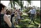 President George W. Bush greets local residents lined up at a food and water distribution center, Thursday, Oct. 27, 2005, in the hurricane damaged area of Pompano Beach, Fla. White House photo by Eric Draper