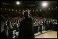 President George W. Bush waves and acknowledges the applause of the audience, following his remarks on the War on Terror, Thursday, Oct. 6, 2005, speaking before the National Endowment for Democracy at the Ronald Reagan Building and International Trade Center in Washington. White House photo by Eric Draper