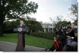 President George W. Bush speaks to the media on the South Lawn regarding the resignation Friday, Oct. 28, 2005, of Vice Presidential Chief of Staff Scooter Libby.  White House photo by Paul Morse