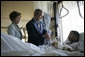 President George W. Bush and Mrs. Laura Bush talk with Sgt. Patrick Hagood of Anderson, S.C., Wednesday, Oct. 5, 2005, during their visit to Walter Reed Army Medical Center in Washington D.C. White House photo by Paul Morse