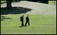 President George W. Bush and Chief of Staff Andrew Card walk alone on the South Lawn in this September 2005 file photo. President Bush announced Tuesday, March 28, 2006, that he had accepted Secretary Card's resignation, effective in April. White House photo by Eric Draper