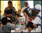 Mrs. Laura Bush meets with teachers and children, Thursday, March 2, 2006, during her visit to Mother Teresa's Jeevan Jyoti (Light of Life) Home for Disabled Children in New Delhi, India. White House photo by Shealah Craighead