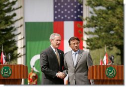 President George W. Bush and Pakistan President Pervez Musharraf stand together following their joint news conference at Aiwan-e-Sadr in Islamabad, Pakistan, Saturday, March 4, 2006.  White House photo by Shealah Craighead