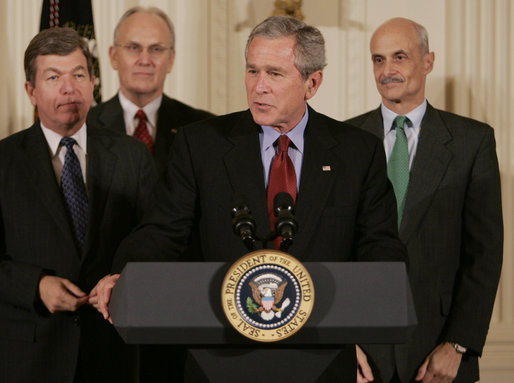 President George W. Bush addresses the audience after signing H.R. 3199, USA Patriot Improvement and Reauthorization Act of 2005, Thursday, March 9, 2006 in the East Room of the White House. President Bush is joined by U.S. Congressman Roy Blunt, R-Mo., left, U.S. Senator Larry Craig, R-Id., background-left, and Homeland Security Secretary Michael Chertoff. White House photo by Kimberlee Hewitt