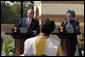 President George W. Bush smiles as he responds to a question Thursday, March 2, 2006, during a press availability with India's Prime Minister Manmohan Singh in the Mughal Garden at the Hyderabad House in New Delhi. White House photo by Paul Morse