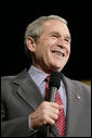 President George W. Bush reacts to a question from the audience following his remarks on the global war on terror Wednesday, March 22, 2006 at the Capitol Music Hall in Wheeling, W. Va. White House photo by Eric Draper