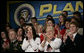 Audience members applaud President George W. Bush as he discusses the global war on terror, Wednesday, March 22, 2006 at the Capitol Music Hall in Wheeling, W. Va. President Bush told the crowd that America has got to appreciate what it means to wear the uniform today, and honor those who have volunteered to keep this country strong. White House photo by Eric Draper