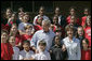 President George W. Bush and Laura Bush pose with students at the College Park Elementary School in Gautier, Miss., Wednesday, March 8, 2006, where Mrs. Bush announced the establishment of The Gulf Coast School Library Recovery Initiative, to help Gulf Coast schools that were damaged by the hurricanes rebuild their book and material collections. The initiative was established by the Laura Bush Foundation for American Libraries. White House photo by Eric Draper