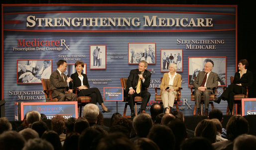 President George W. Bush participates in a Conversation on the Medicare Prescription Drug Benefit, Tuesday, March 14, 2006 at the Canandaigua Academy in Canandaigua, N.Y., with Dr. Mark McClellan and Diane Lawatsch, left, and Bob and Eleanor Wisnieff with Susan Wiber, right. White House photo by Kimberlee Hewitt