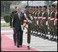 President George W. Bush is escorted by an honor guard as he reviews Pakistan troops at his official welcome to Aiwan-e-Sadr in Islamabad, Pakistan, Saturday, March 4, 2006. White House photo by Eric Draper