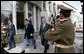 President George W. Bush is accompanied by Afghan President Hamid Karzai at the Presidential Palace in Kabul after President and Mrs. Bush landed in Afghanistan for a brief visit en route to India. During their five-hour stop, they participated in a ceremonial ribbon-cutting at the U.S. Embassy and visited with troops at Bagram Air Base north of the city. White House photo by Eric Draper