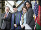 President George W. Bush waves as he stands with President Hamid Karzai of Afghanistan, Mrs. Laura Bush and Secretary of State Condoleezza Rice during welcoming ceremonies Wednesday, March 1, 2006, in Kabul. White House photo by Eric Draper