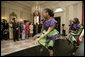 President George W. Bush and Mrs. Laura Bush join Liberia's President Ellen Johnson Sirleaf in viewing a dance performance by Moving in the Spirit, on the State Floor of the White House, Tuesday, March 21, 2006, prior to a social luncheon in honor of President Sirleaf. White House photo by Eric Draper