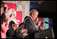 President George W. Bush receives a welcoming ovation as he arrives at the J.W. Marriott Hotel in Washington DC Thursday, April 14, 2005, to address the American Society of Newspaper Editors annual convention. White House photo by Paul Morse