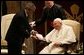 The President presents the Medal of Freedom to Pope John Paul II during a visit to the Vatican in Rome, Italy in June 2004. White House photo by Eric Draper