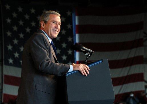 President George W. Bush reacts to the crowd during the Tennessee Welcome at the Tri-City Aviation in Blountville, Tennessee, Saturday, Nov.2, 2002. White House photo by Eric Draper.