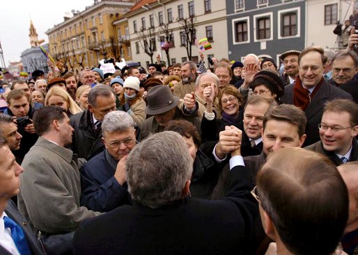 President George W. Bush greets Lithuanians in person at the Rotuse Square in the center of Vilnius, Lithuania, Nov. 23. "This is a great day in the history of Lithuania, in the history of the Baltics, in the history of NATO, and in the history of freedom," said President Bush in his remarks. "And I have the honor of sharing this message with you: We proudly invite Lithuania to join us in NATO, the great Atlantic Alliance." White House photo by Paul Morse