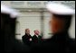 President George W. Bush and Lithuanian President Valdas Adamkus stand at attention during a welcoming ceremony at the Prezidentura, the Presidential Palace, in Vilnius, Lithuania, Nov. 23. A former Chicago-area resident and U.S. environmental regulator, President Adamkus was elected to office in 1998. White House photo by Paul Morse.