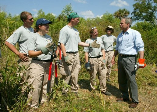 President George W. Bush talks with AmeriCorps volunteers at Rookery Bay National Estuarine Research Reserve in Naples, Fla., Friday, April 22, 2004. "Here at Rookery Bay, you see how important wetlands are to protecting 150 species of birds, and many threatened and endangered animals," said the President in his remarks. White House photo by Eric Draper