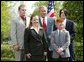 President George W. Bush congratulates the Busy Bison 4-H Club of Barrackville, W.Va., on receiving the President’s Environmental Youth Award in the East Garden April 22, 2004. Members of this club include, from left to right, James Taylor, 15, Katie Ridenour, 16, Cody Gallagher, 9, and Derek Swiger. White House photo by Susan Sterner.