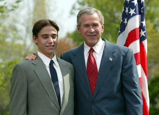 President George W. Bush congratulates Benjamin Banwart, 18, of Shakopee, Minn., on receiving the President’s Environmental Youth Award in the East Garden April 22, 2004. White House photo by Susan Sterner.