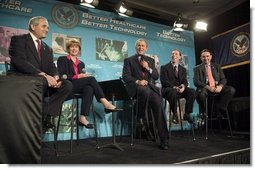 President George W. Bush participates in a conversation on the benefits of health care information technology with, from left, Anthony Principi, Secretary of Veterans Affairs, Marlene Miller, M.D. of John Hopkins Children's Center, Dennis Smith of VA Maryland Health Care System and Tommy Thompson, Secretary of Health and Human Services at the Department of Veterans Affairs Medical Center in Baltimore, Maryland on April 27, 2004.  White House photo by Paul Morse