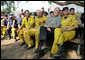 President George W. Bush visits a base camp Thursday, Oct. 25, 2007, for First Responders battling the Southern California wildfires. "I'm telling you, there's a lot of folks that live up in these hills that have their houses because of you," the President told the fire fighters. ". They're not in a position to thank you -- but we are. And so we thank you for helping save lives and save property." White House photo by Eric Draper