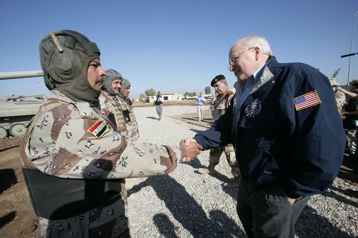 Vice President Dick Cheney visits the 9th Mechanized Infantry Division HQ at Taji Air Base to greet Iraqi troops and view tanks and armored vehicles they have refurbished into working fighting vehicles, Sunday Dec. 18, 2005. White House photo by David Bohrer