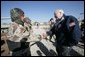 Vice President Dick Cheney visits the 9th Mechanized Infantry Division HQ at Taji Air Base to greet Iraqi troops and view tanks and armored vehicles they have refurbished into working fighting vehicles, Sunday Dec. 18, 2005. White House photo by David Bohrer