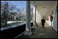 President George W. Bush takes a brisk walk along the colonnade in the Rose Garden Friday morning, Dec. 9, 2005. White House photo by Kimberlee Hewitt