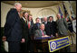 President George W. Bush smiles as he signs into law H.R. 2520, the Stem Cell Therapeutic and Research Act of 2005, during ceremonies Tuesday, Dec. 20, 2005, in the Roosevelt Room of the White House. White House photo by Paul Morse