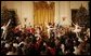 Children gather in the East Room of the White House, Monday, Dec. 5, 2005, as they watch a dance performance during the White House Children's Holiday Reception in the East Room. White House photo by Shealah Craighead